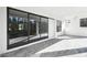 Covered patio with brick pavers and sliding glass doors at 4817 Majestic Hills Loop, Brooksville, FL 34601