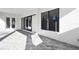 Covered patio with brick pavers and sliding glass doors at 4817 Majestic Hills Loop, Brooksville, FL 34601