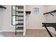 Well-organized walk-in closet with custom black shelving and natural light at 4817 Majestic Hills Loop, Brooksville, FL 34601