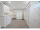 Walk-in closet with custom shelving, cabinets, and drawers for ample storage space at 5455 Lake Le Clare Rd, Lutz, FL 33558