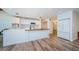 Bright kitchen with white cabinets, butcher block island, and modern appliances at 5455 Lake Le Clare Rd, Lutz, FL 33558