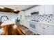 Modern kitchen featuring white cabinets, butcher block countertops, and open layout at 5455 Lake Le Clare Rd, Lutz, FL 33558