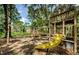 A large wooden playground with a slide, swings, and fort provides ample space for outdoor fun at 5455 Lake Le Clare Rd, Lutz, FL 33558