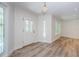 Bright entryway with hardwood floors and stained glass at 5455 Lake Le Clare Rd, Lutz, FL 33558