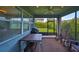 Relaxing screened porch with table, chairs, and ceiling fan at 7023 Old Benton Dr, Apollo Beach, FL 33572