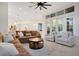 Open living room with kitchen views and access to the pool area at 1935 Lago Vista Blvd, Palm Harbor, FL 34685