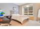 Bedroom with a queen-size bed and built-in window seat at 1935 Lago Vista Blvd, Palm Harbor, FL 34685