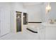 Spa-like bathroom with soaking tub, walk-in shower, and double vanity at 1935 Lago Vista Blvd, Palm Harbor, FL 34685