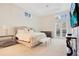 Relaxing main bedroom with king-size bed, access to the pool, and plenty of natural light at 1935 Lago Vista Blvd, Palm Harbor, FL 34685