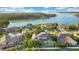 Aerial view of the house and surrounding waterfront community at 1935 Lago Vista Blvd, Palm Harbor, FL 34685