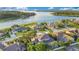 Aerial view showcasing the property's waterfront location and neighborhood at 1935 Lago Vista Blvd, Palm Harbor, FL 34685