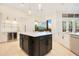 Spacious kitchen with a large island and breakfast bar, wine cooler at 1935 Lago Vista Blvd, Palm Harbor, FL 34685