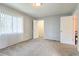 Simple bedroom with grey carpet and closet at 1877 Pine Cone Cir, Clearwater, FL 33760