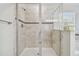 Large walk-in shower with neutral tile and glass enclosure at 8643 Corinthian Way, New Port Richey, FL 34654