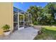 Screened patio and fire pit create a relaxing outdoor space at 8643 Corinthian Way, New Port Richey, FL 34654