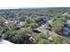Aerial view highlighting the property's proximity to lush greenery, waterfront, and residential streets at 1155 7Th N St, Safety Harbor, FL 34695