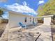Backyard with a waterfront view and a concrete patio featuring lounge chairs, perfect for relaxation at 1155 7Th N St, Safety Harbor, FL 34695