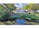 Scenic backyard featuring a waterfront view, a pier, and a fenced yard at 1155 7Th N St, Safety Harbor, FL 34695