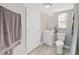 Bathroom with white vanity and standard toilet at 1155 7Th N St, Safety Harbor, FL 34695
