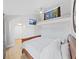 Bedroom features wood floors, a bunk bed, and a mounted TV at 1155 7Th N St, Safety Harbor, FL 34695