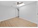 Bedroom features wood floors, ceiling fan, and walk-in closet at 1155 7Th N St, Safety Harbor, FL 34695