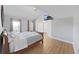 Bright bedroom with wood floors, two windows, and closet at 1155 7Th N St, Safety Harbor, FL 34695