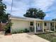 Welcoming home with a covered front porch, perfect for relaxing outdoors at 1155 7Th N St, Safety Harbor, FL 34695