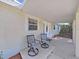 Relaxing front porch with seating area, perfect for enjoying the outdoors at 1155 7Th N St, Safety Harbor, FL 34695