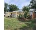 Charming single-story home with a well-maintained front yard and covered porch at 1155 7Th N St, Safety Harbor, FL 34695