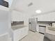 Bright kitchen features stainless steel appliances, granite countertops, and white cabinets at 1155 7Th N St, Safety Harbor, FL 34695