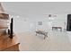 Open concept living room with white walls, tile flooring, and recessed lighting providing a spacious and airy feel at 1155 7Th N St, Safety Harbor, FL 34695