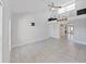 Open-concept living room with vaulted ceilings, clerestory windows, and a neutral color palette creates a bright and airy space at 1155 7Th N St, Safety Harbor, FL 34695
