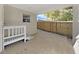 Covered patio area with a white bench and a view of the fenced backyard at 1155 7Th N St, Safety Harbor, FL 34695