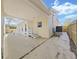 Covered patio area with stairs leading to a door and a view of the fenced backyard at 1155 7Th N St, Safety Harbor, FL 34695