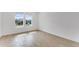 Bright bedroom with wood-look tile floors and natural light at 4638 Southern Valley Loop, Brooksville, FL 34601