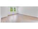 Bright bedroom with wood flooring and large windows for natural light at 4638 Southern Valley Loop, Brooksville, FL 34601