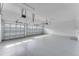 Spacious two car garage features epoxy flooring, ample lighting, and automatic doors at 4638 Southern Valley Loop, Brooksville, FL 34601