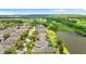 Aerial view of the community with lake and lush greenery at 7127 Forest Mere Dr, Riverview, FL 33578