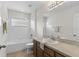 Cozy bathroom features a shower over tub, vanity with sink, and tile flooring at 7127 Forest Mere Dr, Riverview, FL 33578
