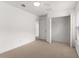 Neutral bedroom with closet and abundant natural light, carpet flooring, and white trim creating a bright space at 7127 Forest Mere Dr, Riverview, FL 33578
