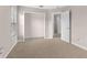 Neutral bedroom featuring carpet flooring, closet, and natural light, a simple yet inviting space at 7127 Forest Mere Dr, Riverview, FL 33578