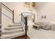 Foyer with carpeted staircase, open floor plan and natural light at 7127 Forest Mere Dr, Riverview, FL 33578