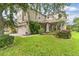 Charming two-story home features lush green lawn, attached two car garage and traditional curb appeal at 7127 Forest Mere Dr, Riverview, FL 33578