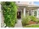 Covered front porch, traditional columns, mature landscaping and custom front door at 7127 Forest Mere Dr, Riverview, FL 33578