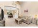 Spacious living room with neutral decor and a view into the dining area at 7127 Forest Mere Dr, Riverview, FL 33578