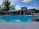 The community pool with a sprawling deck is surrounded by inviting lounge chairs, providing a relaxing retreat at 7127 Forest Mere Dr, Riverview, FL 33578