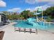 The community pool offers a splash area with a slide and bucket drop, perfect for Gathering fun and enjoyment at 7127 Forest Mere Dr, Riverview, FL 33578