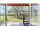 View from patio doors showcasing backyard and spiral staircase at 9550 Tara Cay Ct # 17, Seminole, FL 33776