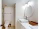 Bright bathroom with double vanity, updated fixtures, and a walk-in shower at 9550 Tara Cay Ct # 17, Seminole, FL 33776