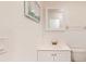 Small bathroom with white vanity, toilet, and medicine cabinet at 9550 Tara Cay Ct # 17, Seminole, FL 33776